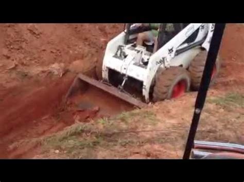 can a skid steer dig a driveway|mini skids how to dig.